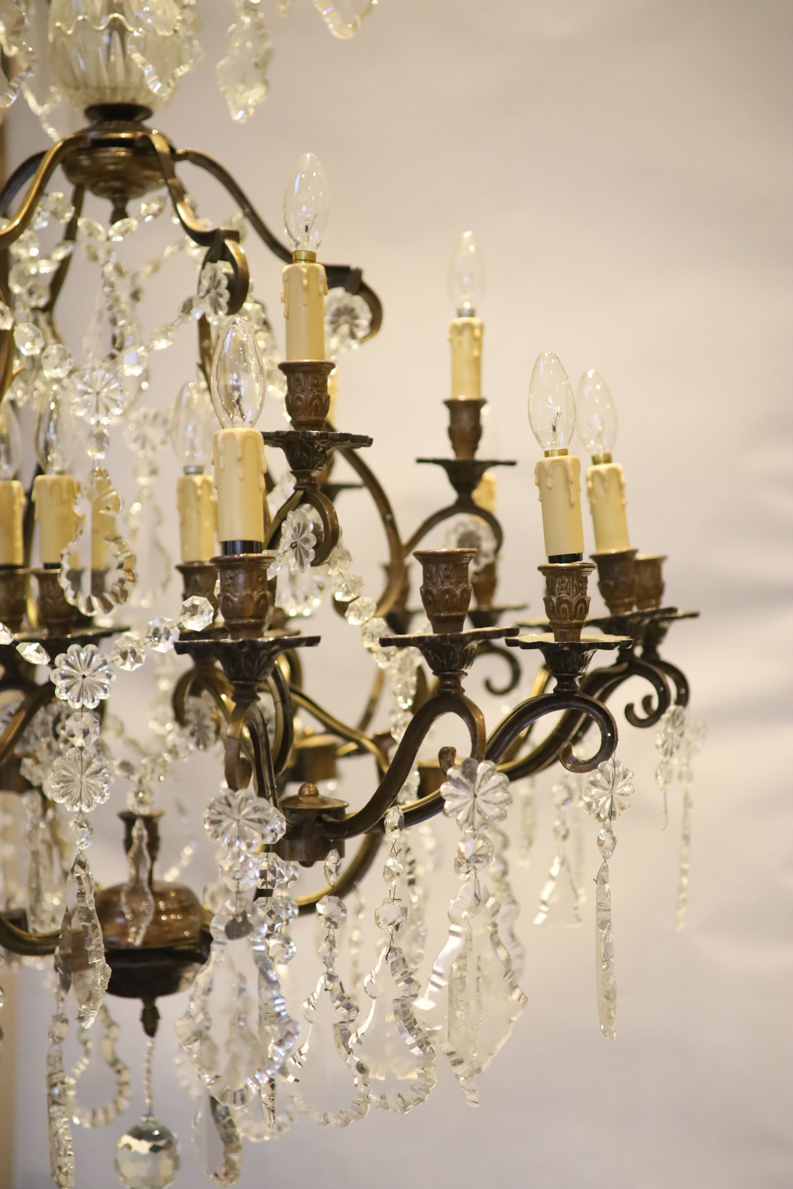 An 18th century style bronzed metal, cut glass 30 light chandelier by Christopher Wray, approximately 123 cm high
